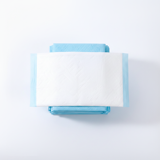 Top-down overhead view of stacked disposable pet training pads