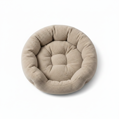 Top-down view of round sherpa donut pet bed